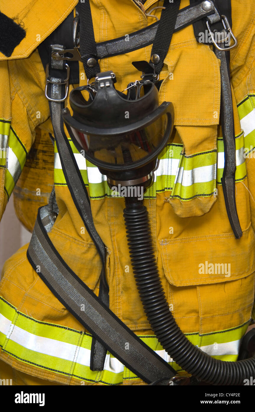 protective fire suit with gas mask - yellow Stock Photo