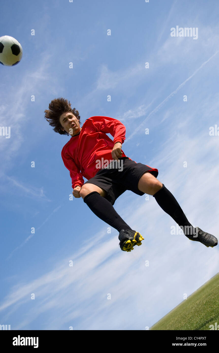 Professional football player header ball hires stock photography and