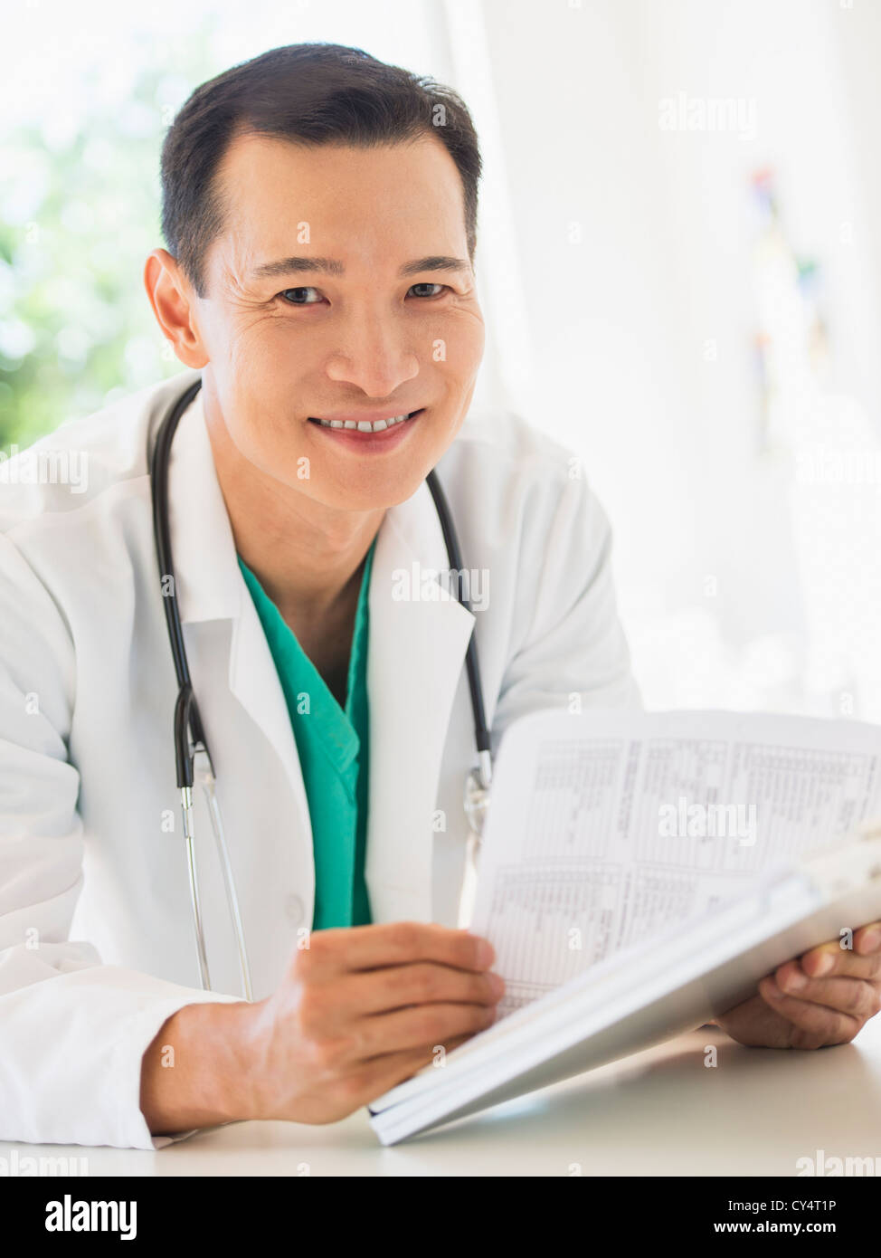 USA, New Jersey, Jersey City, Doctor examining medical records Stock Photo Alamy