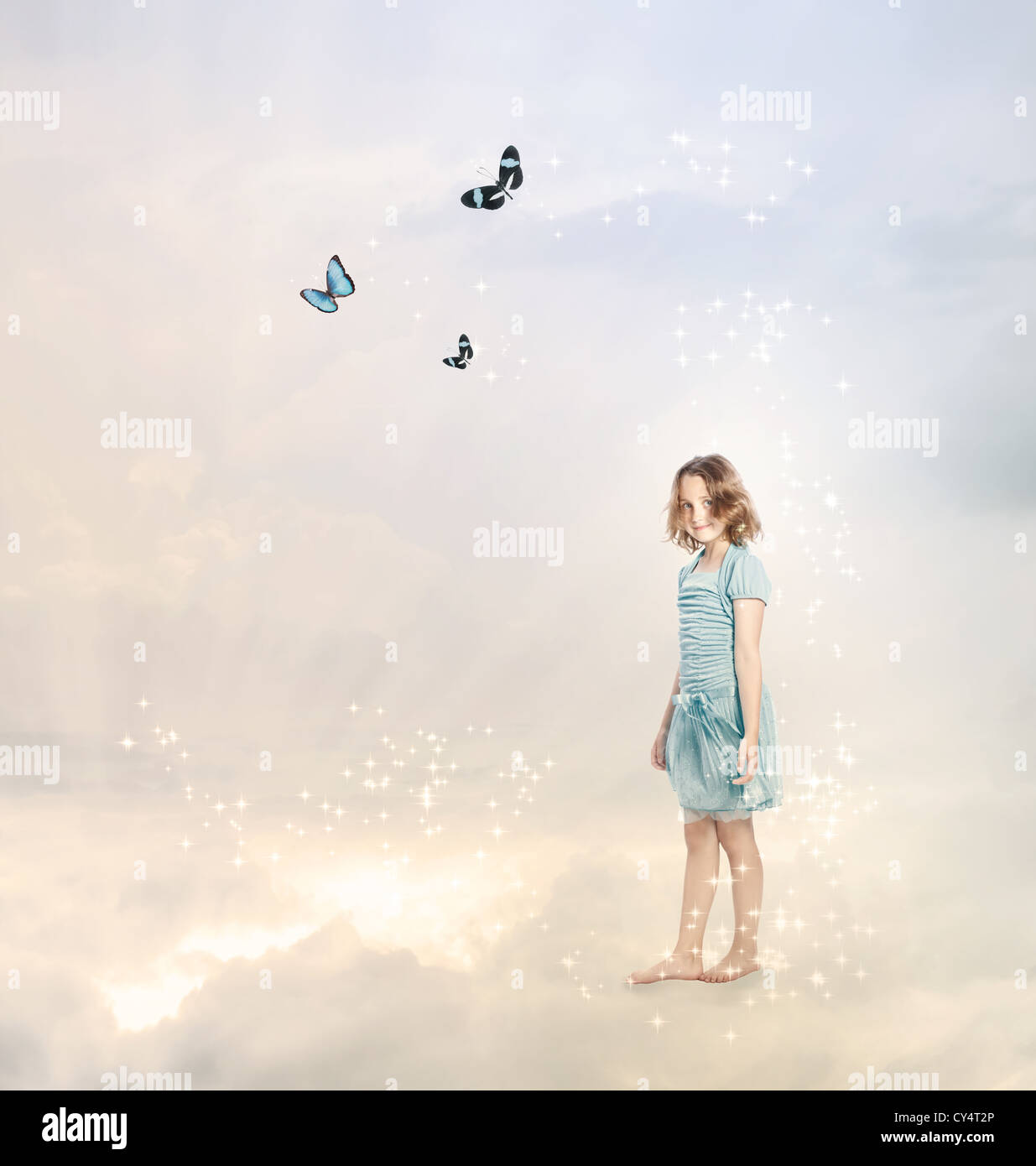 Girl in the Clouds with Butterflies Stock Photo