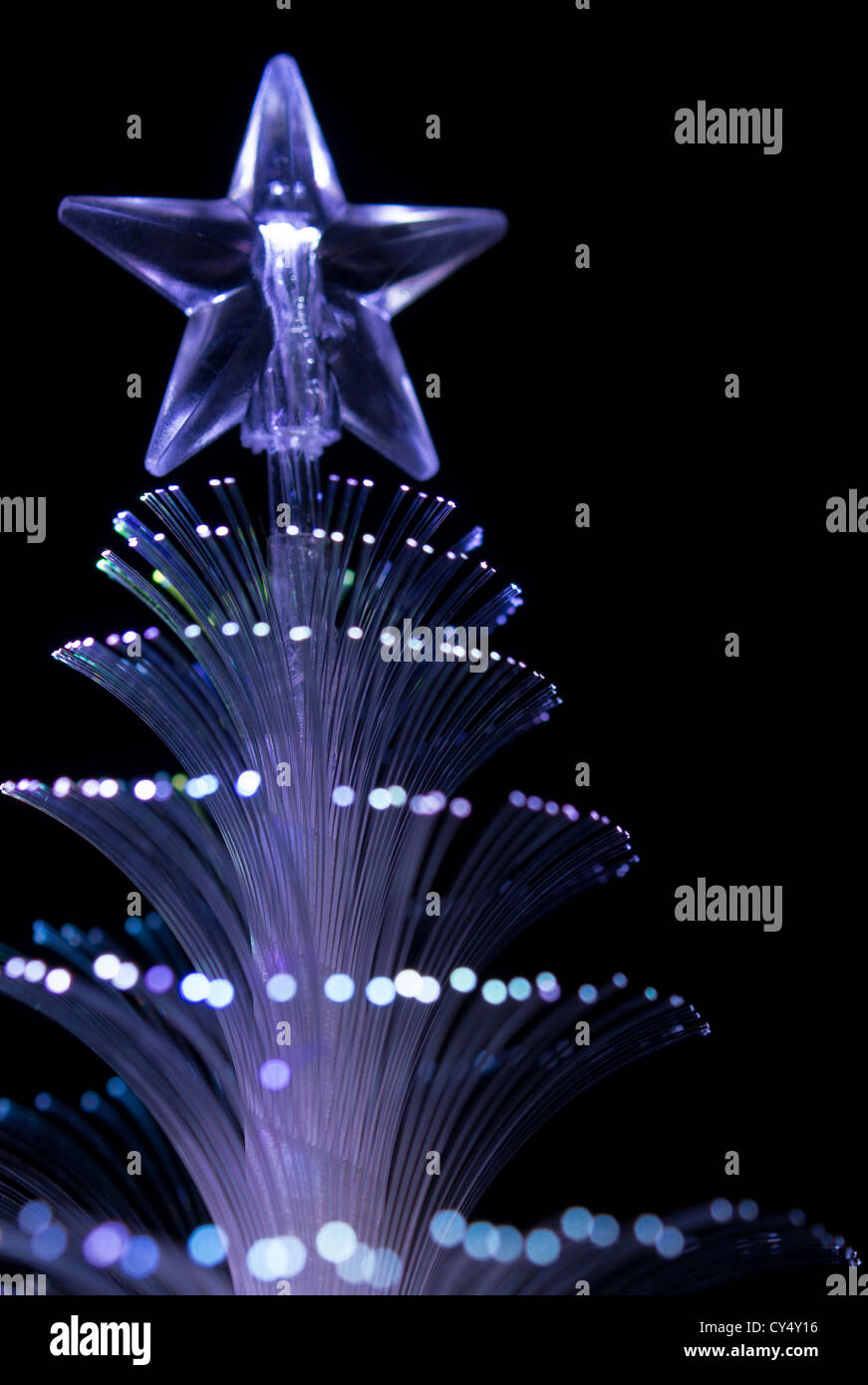 Blue  fiber optic Christmas tree light on black background Stock Photo