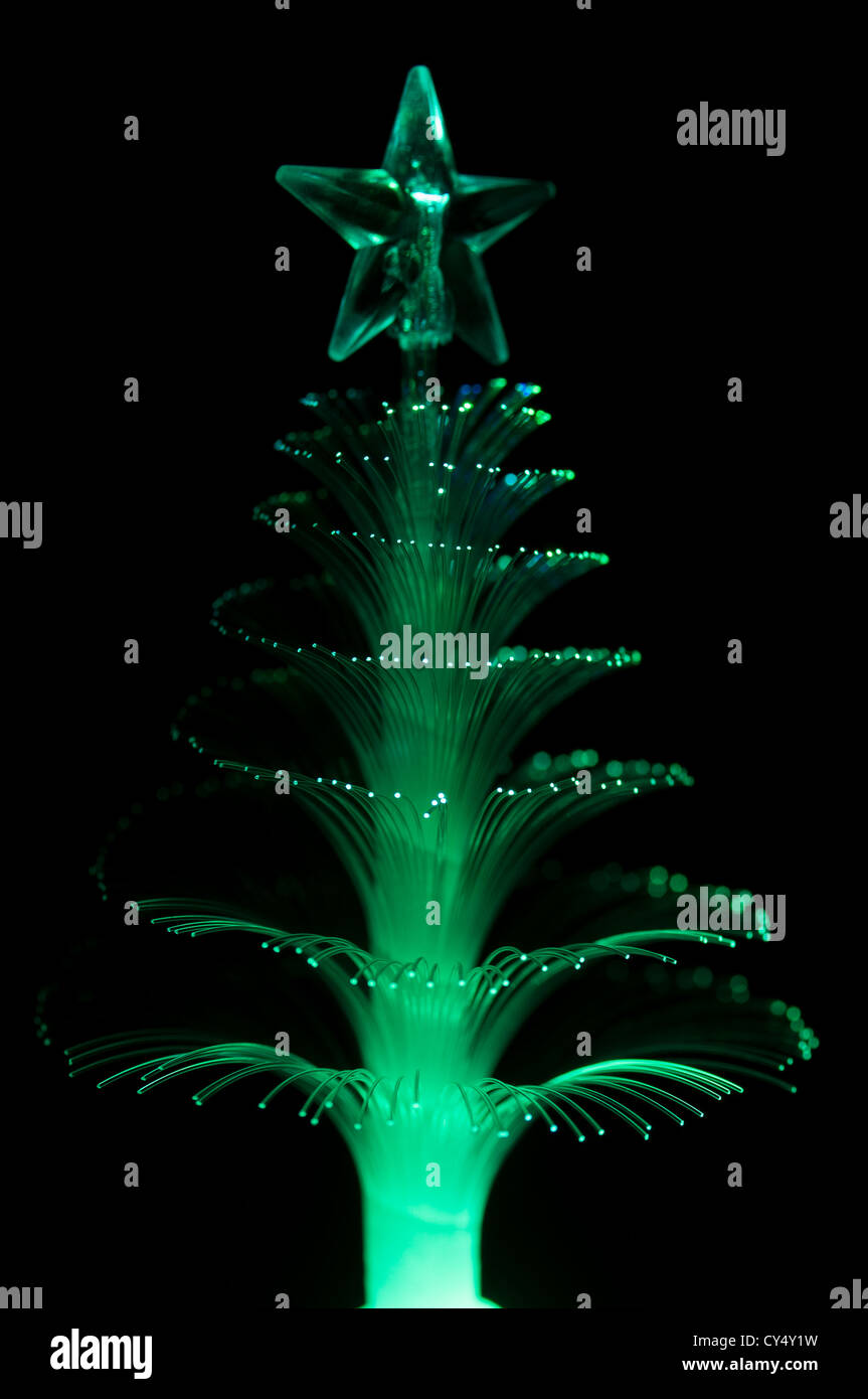 Green fiber optic Christmas tree light on black background Stock Photo