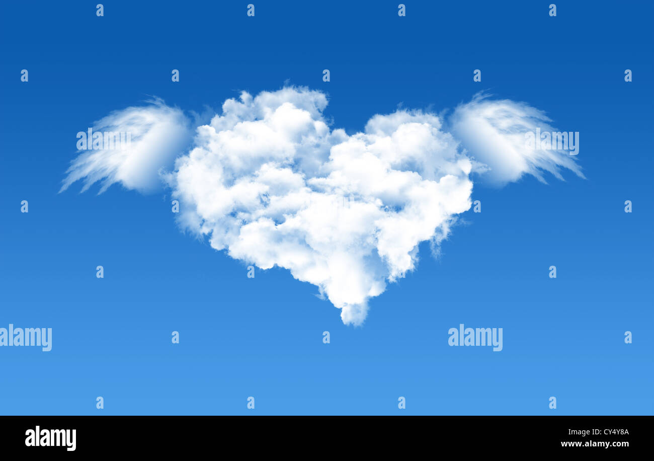 A heart shaped cloud formation against clear blue sky and flying with ...