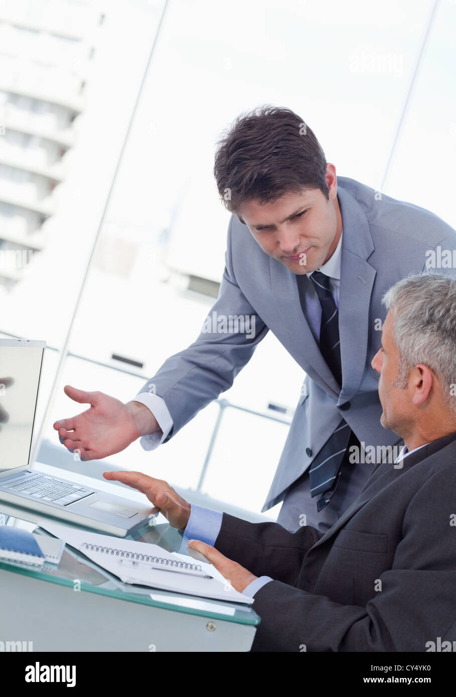 Portrait of professional businessmen working with a laptop Stock Photo