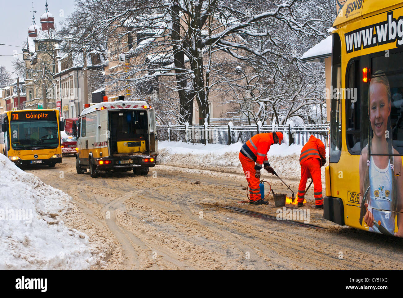 Works on the rails of a tram in a traffic chaos in winter, Dresden, Germany. Stock Photo