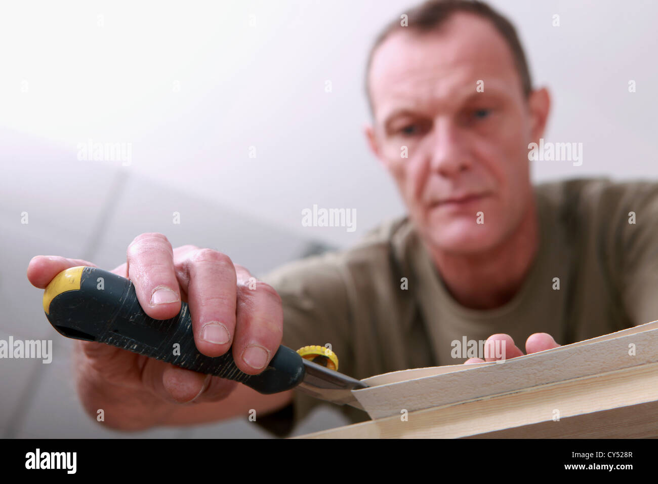 Man cutting paper Stock Photo Alamy