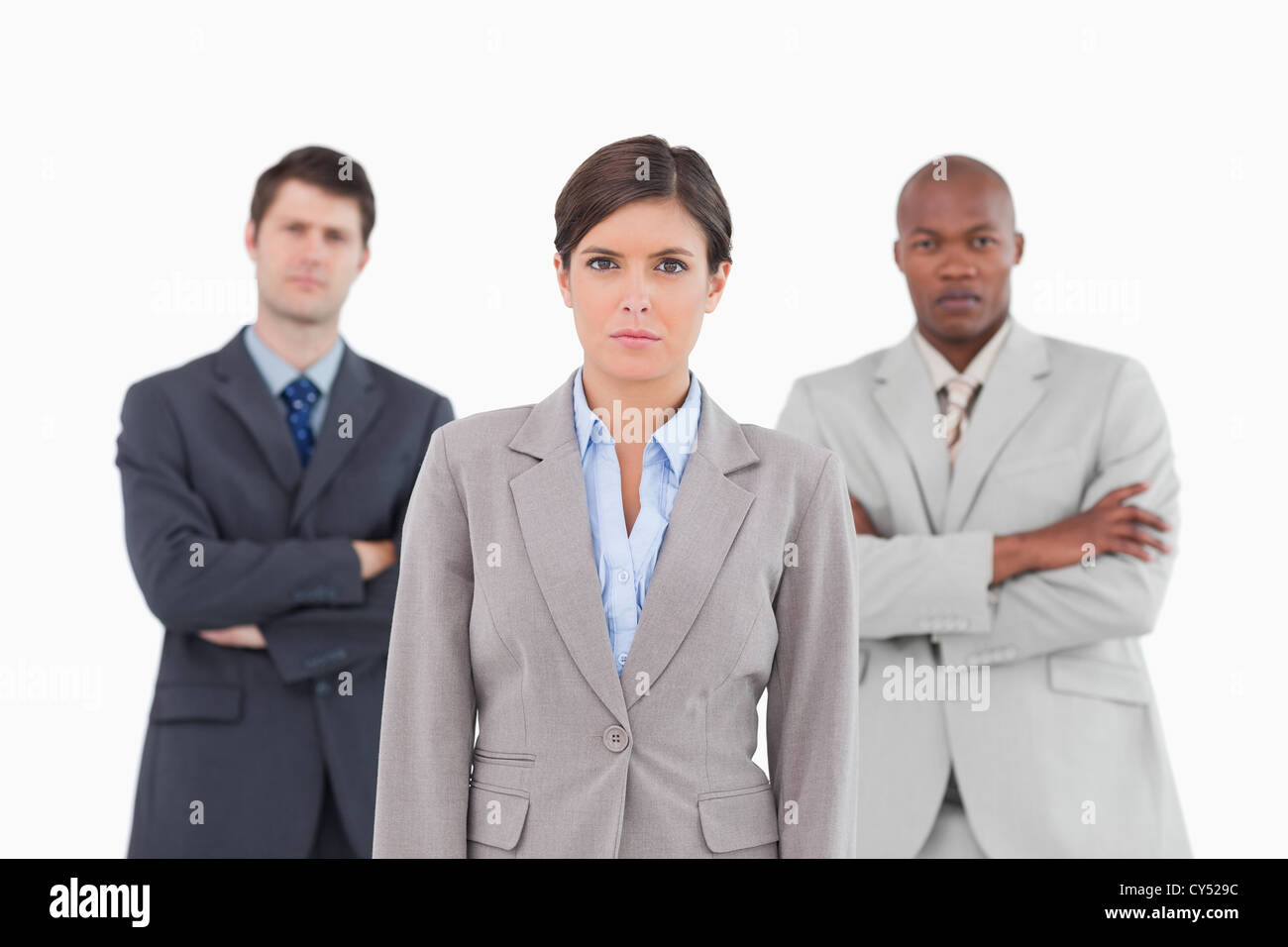 Confident business team standing together Stock Photo - Alamy