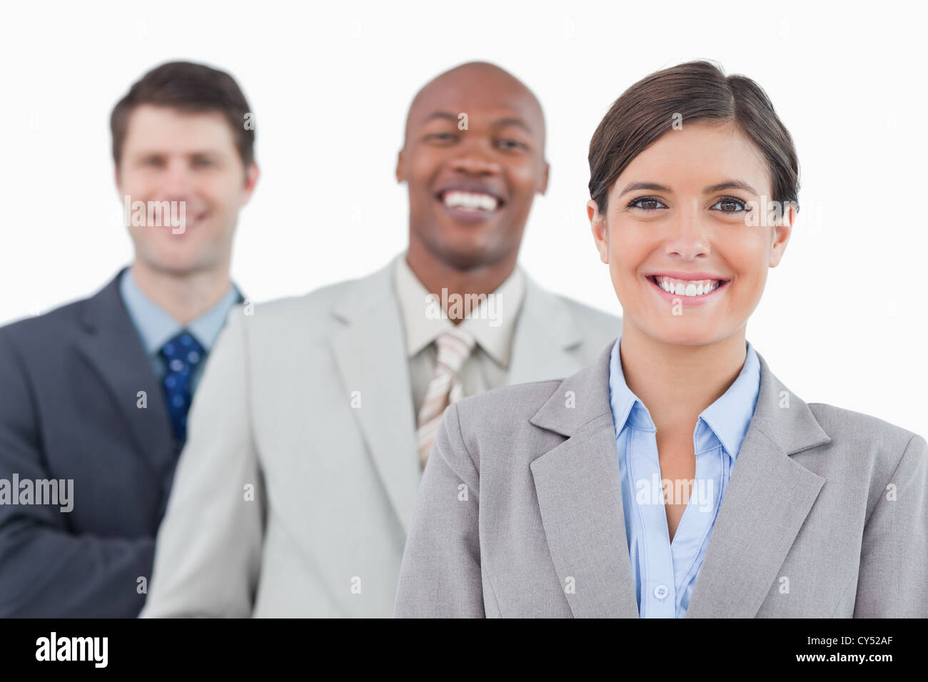 Smiling business team standing together Stock Photo - Alamy