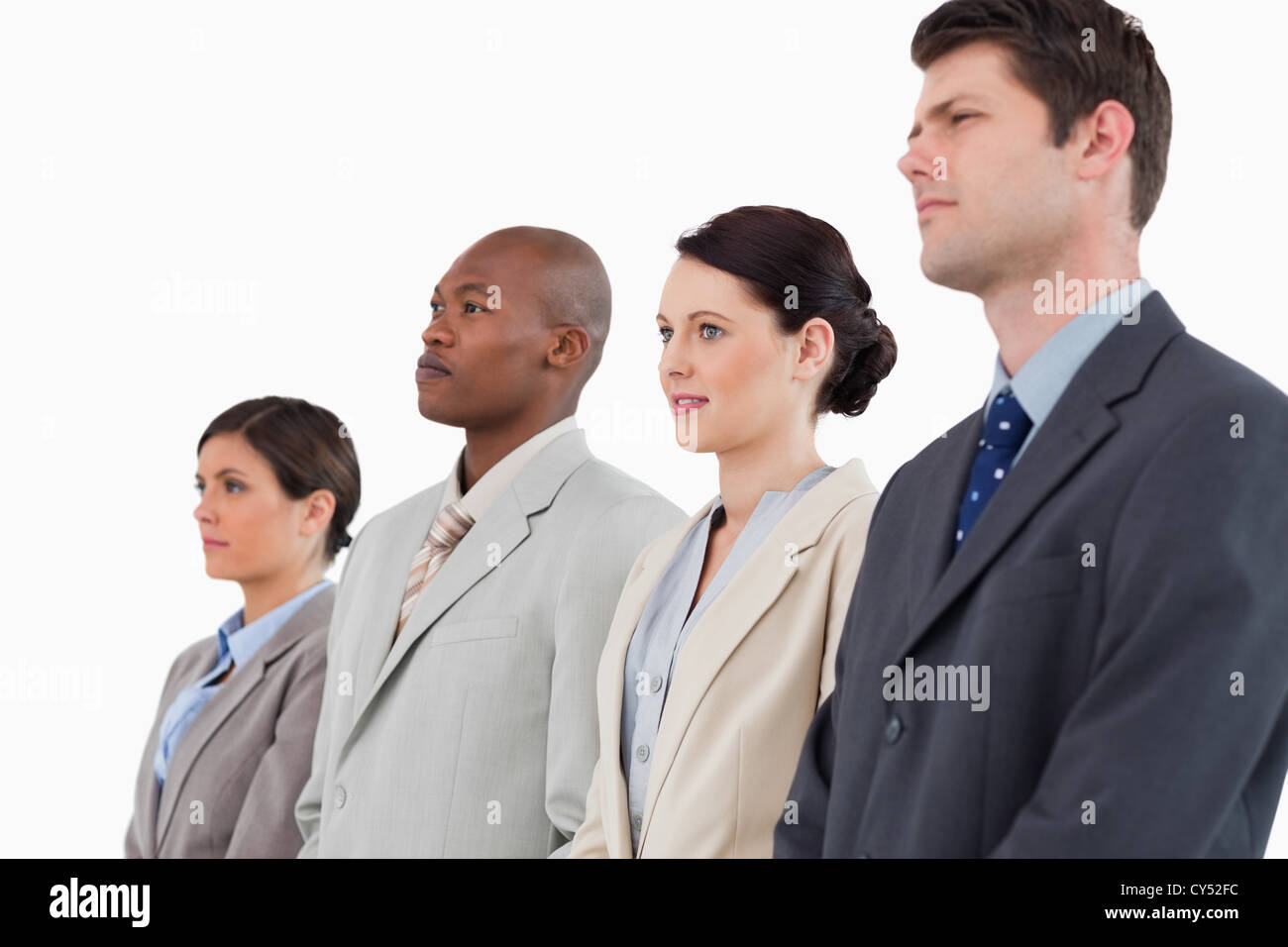 Side view of business team standing together Stock Photo - Alamy