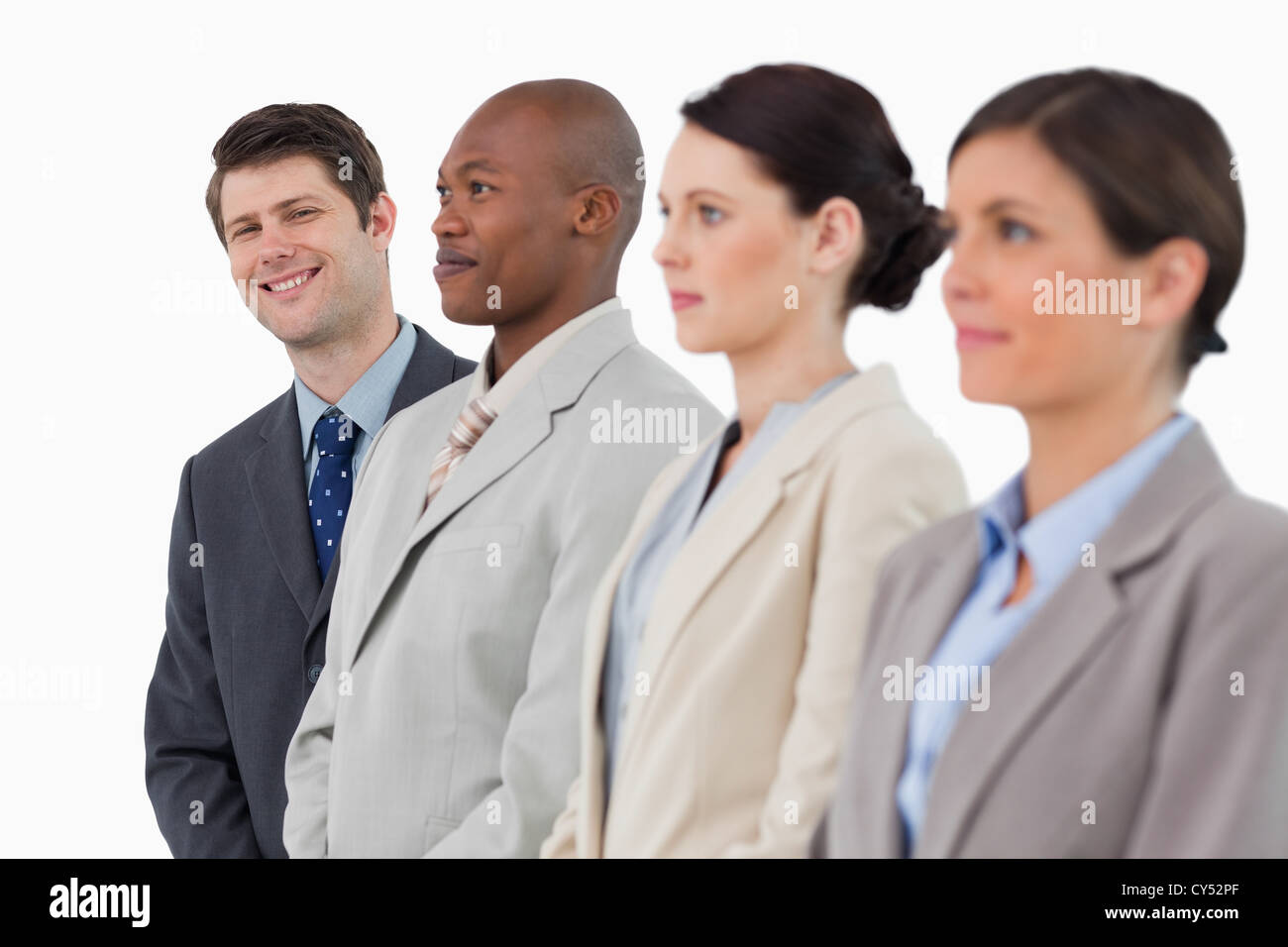 Smiling businessman standing next to his colleagues Stock Photo - Alamy