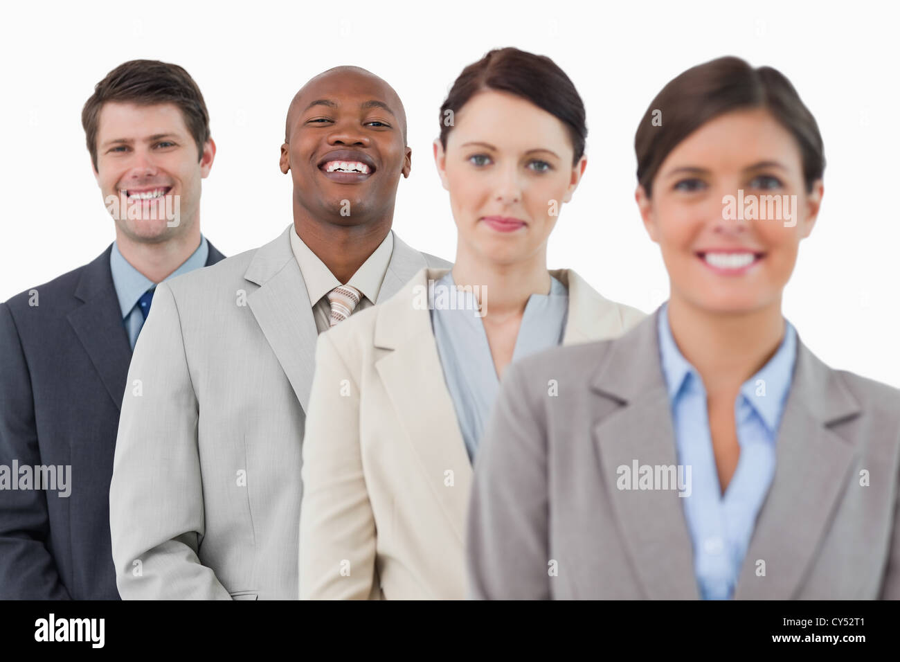 Confident smiling business team standing together Stock Photo - Alamy