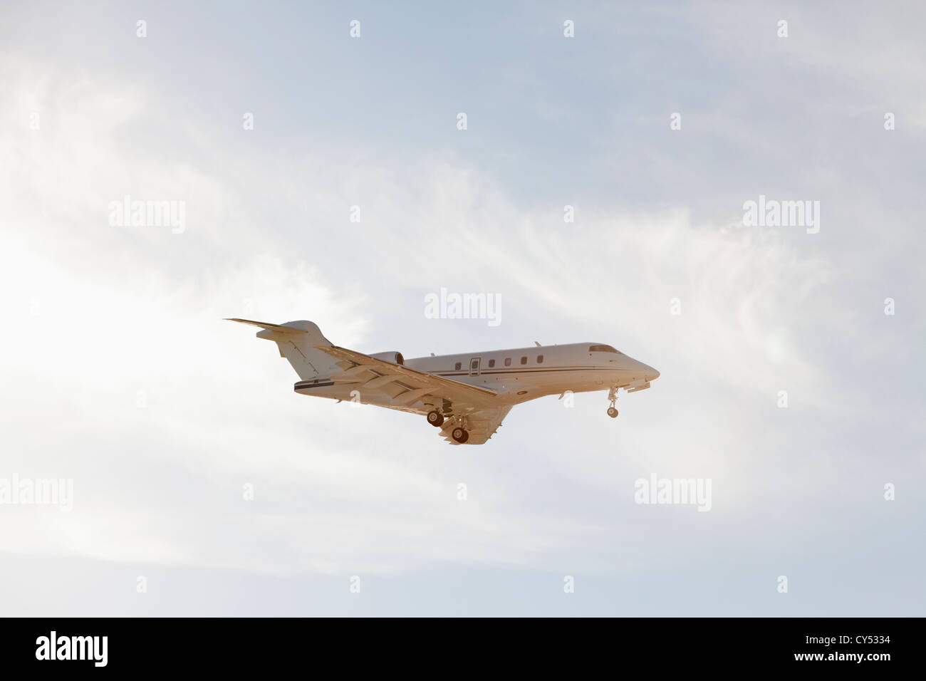 Private leer jet flying through air Stock Photo