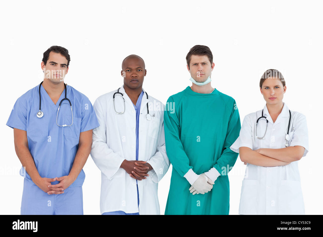 Serious looking medical team standing together Stock Photo - Alamy