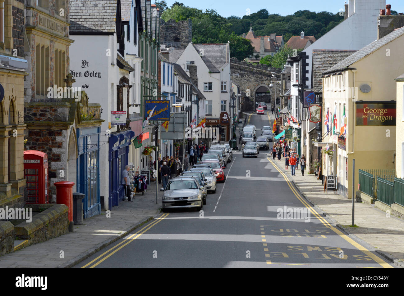 Conwy Wales town centre with part of town wall road arch distant Clwyd North Wales UK Stock Photo