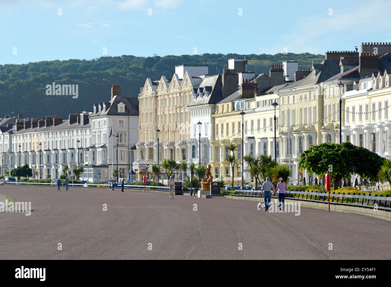 Llandudno Promenade and seafront hotels early morning summertime with just a few walkers