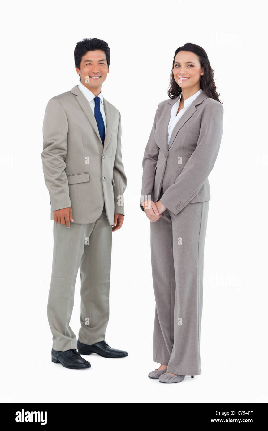 Smiling trading partners standing Stock Photo