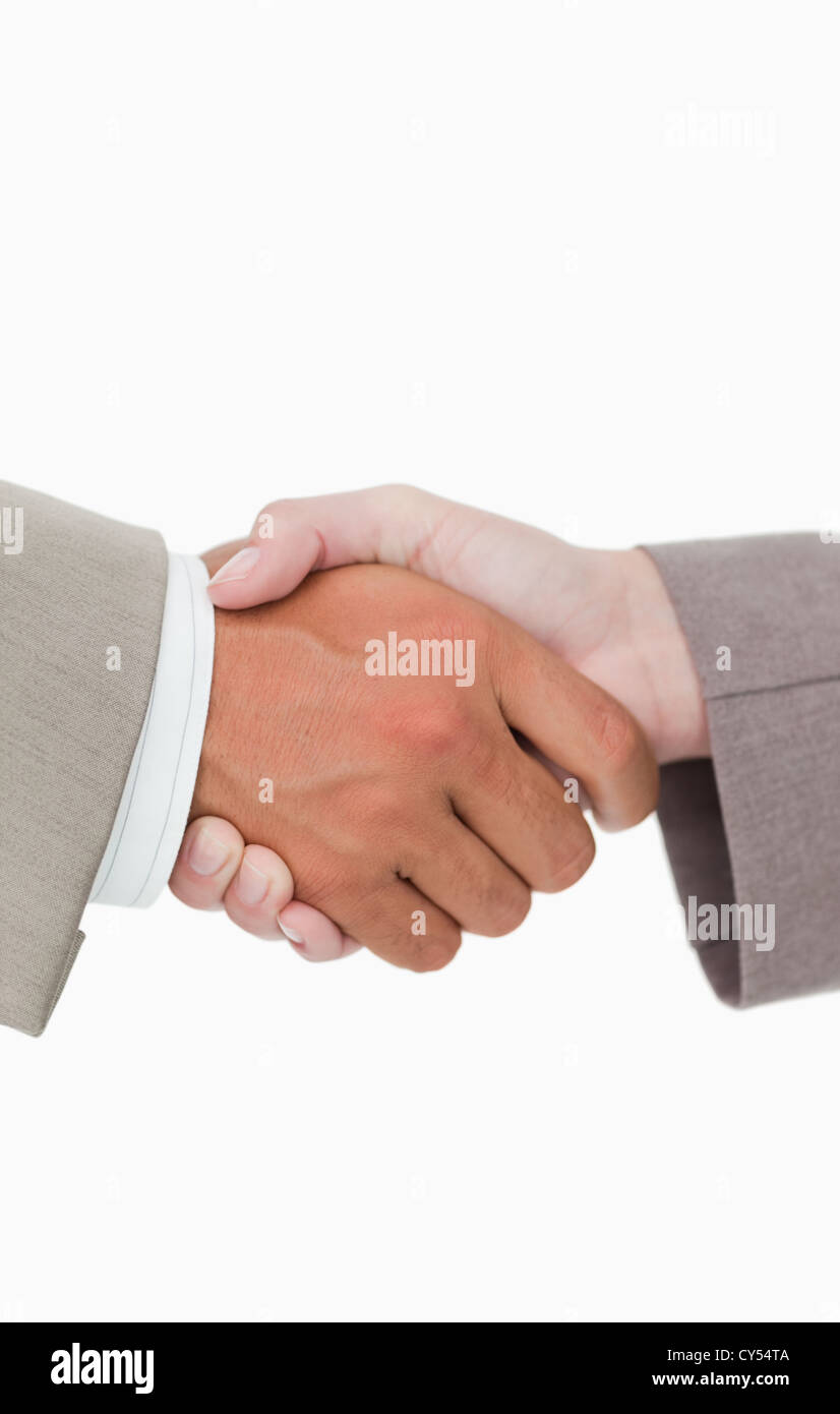 Side view of shaking hands closing a deal Stock Photo