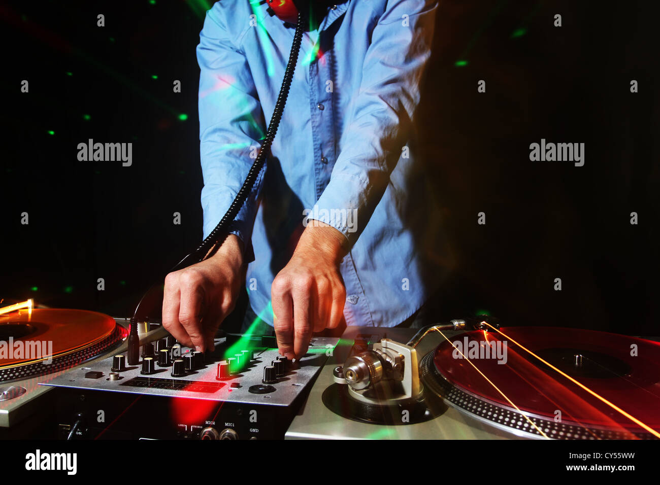 a cool male dj on the turntables Stock Photo