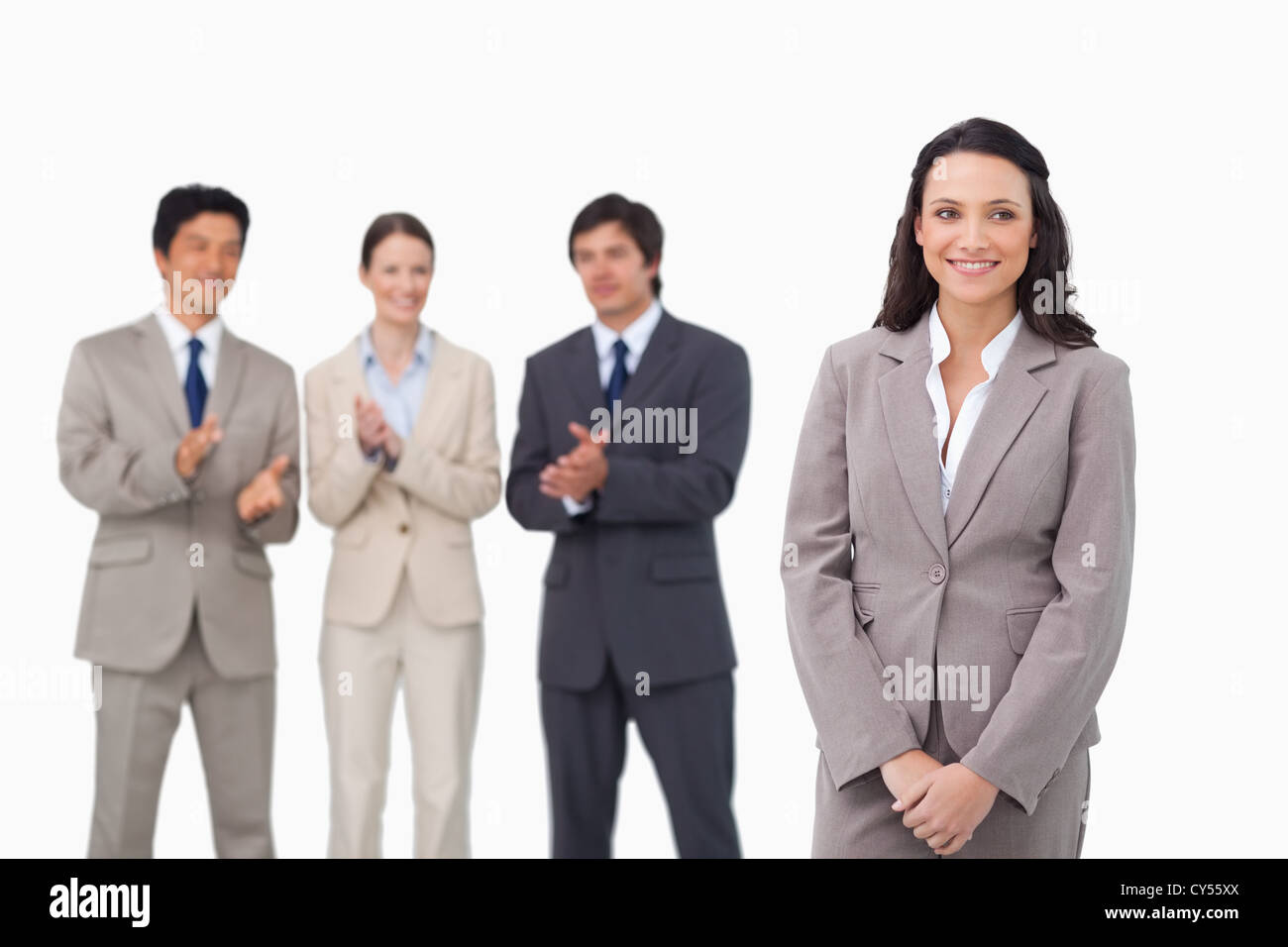 Getting Applause Businesswoman getting applause by colleagues Stock Photo - Alamy