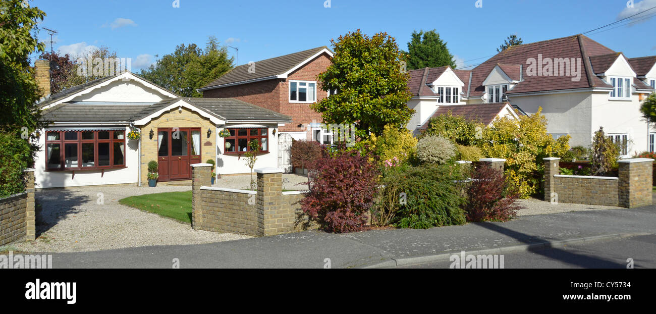 Mixed housing types in village residential street Stock Photo