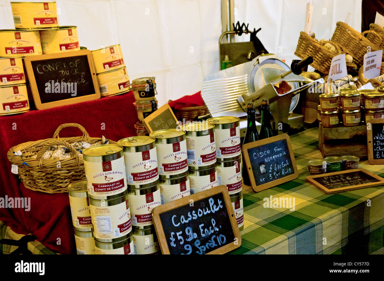 Tins of cassoulet food for sale on continental market stall York North Yorkshire England UK United Kingdom GB Great Britain Stock Photo