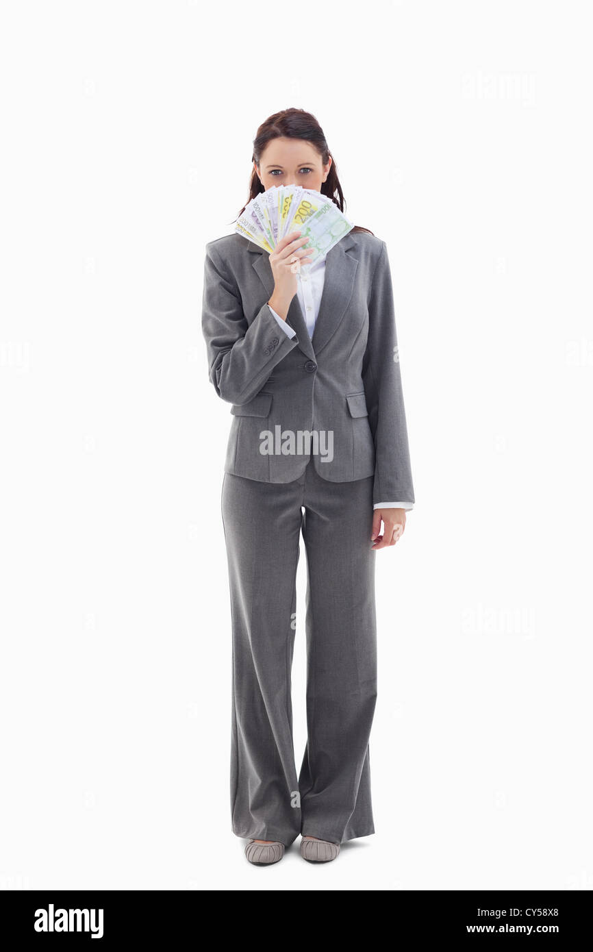 Businesswoman holding bank notes in her hand Stock Photo