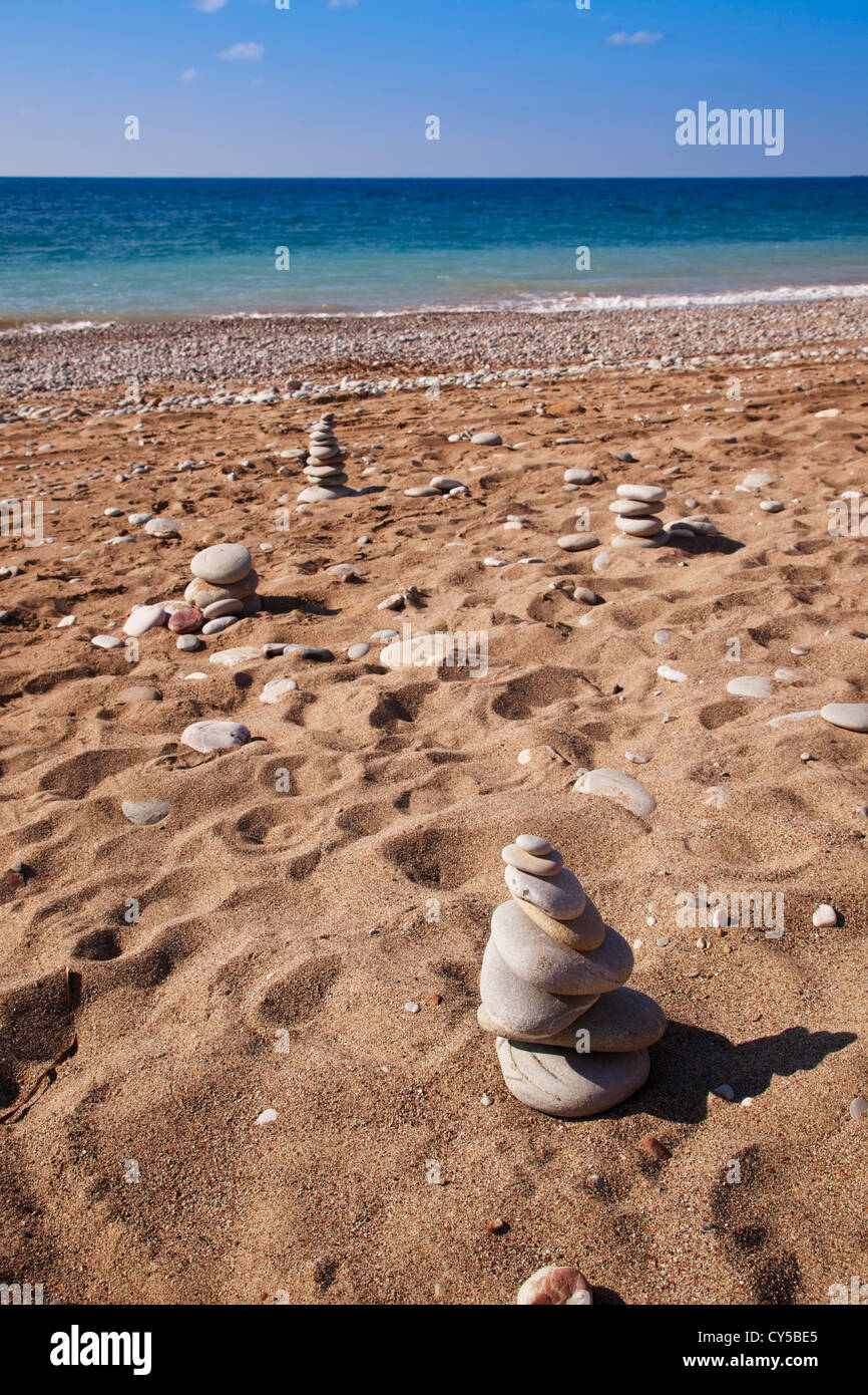 stone piles on the beach at Coral bay, Cyprus. Stock Photo