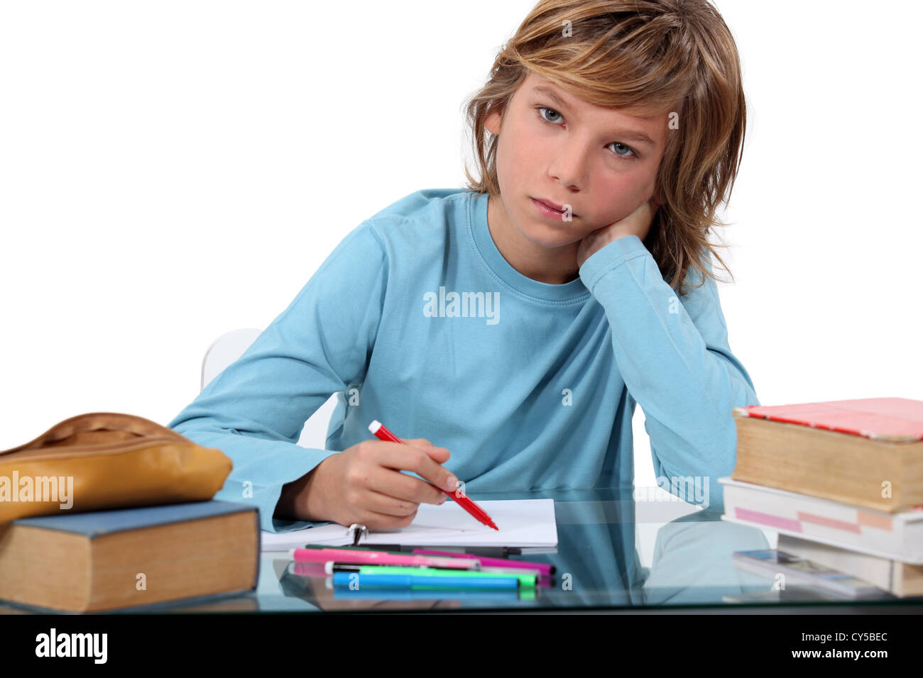 teenage boy doing homework Stock Photo - Alamy