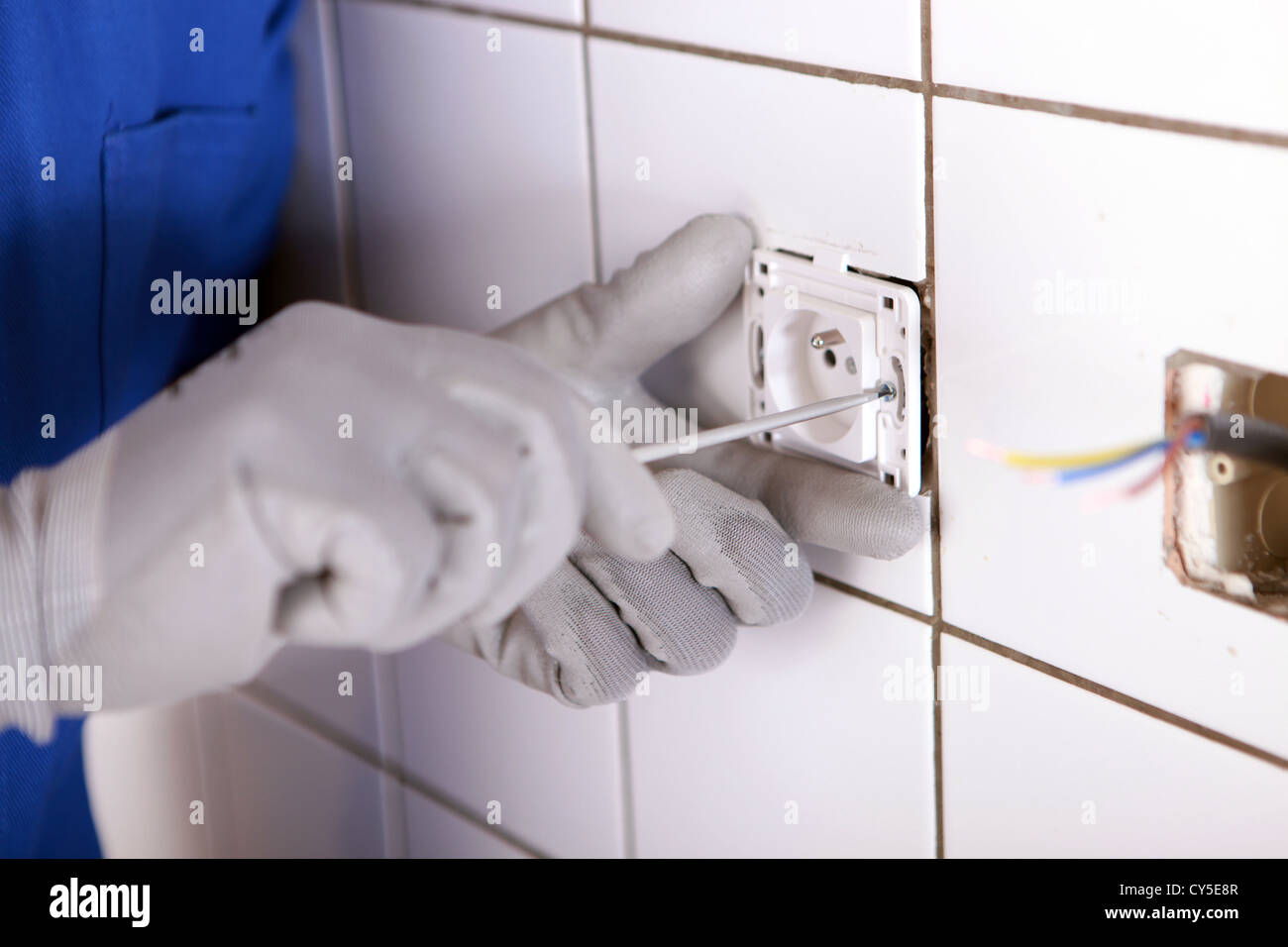 Repairing bathroom electrical socket Stock Photo Alamy