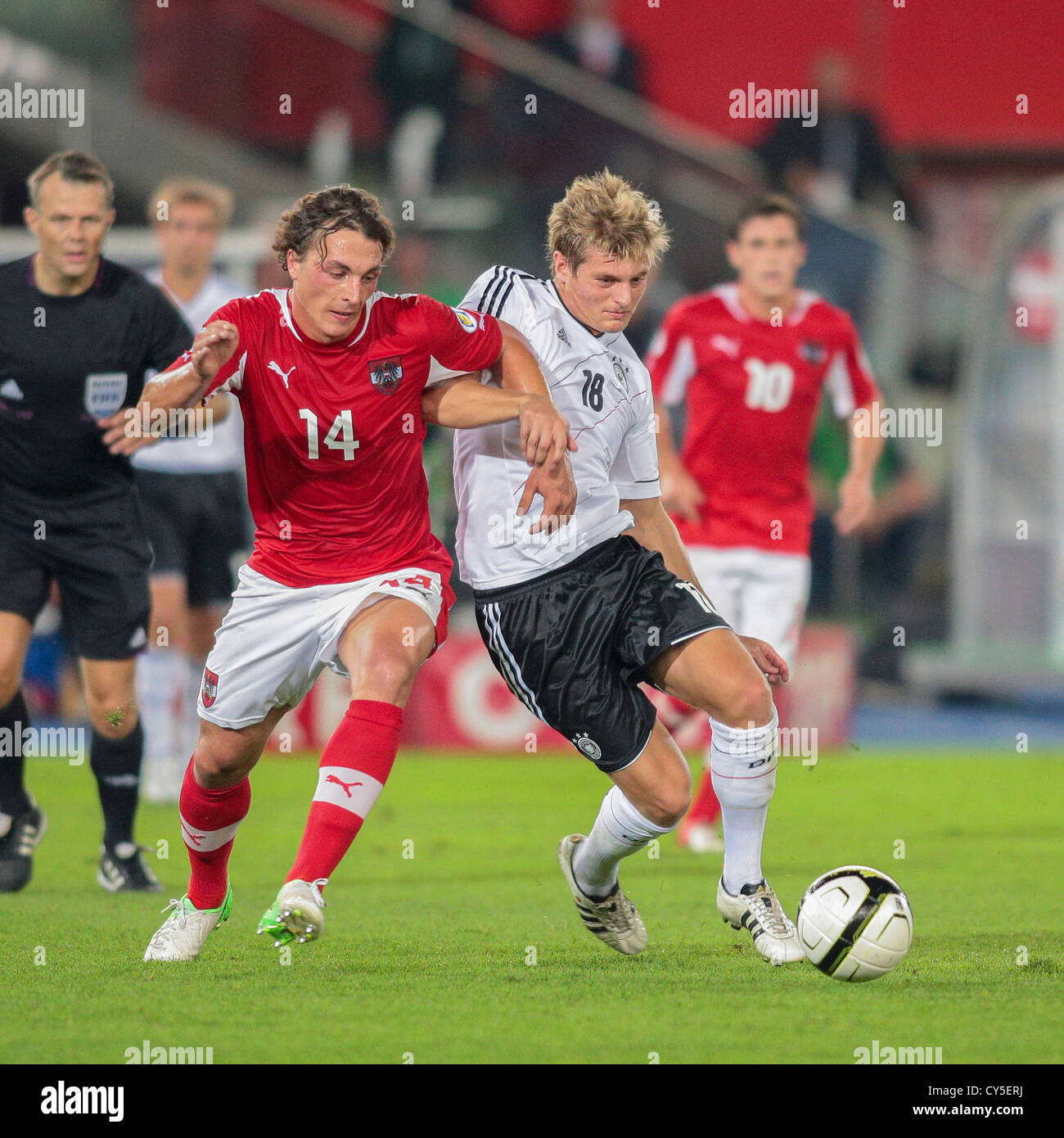 VIENNA, AUSTRIA - SEPTEMBER 11 Julian Baumgartlinger (#14 Austria) and Toni Kroos (#18 Germany) fight for the ball. Stock Photo