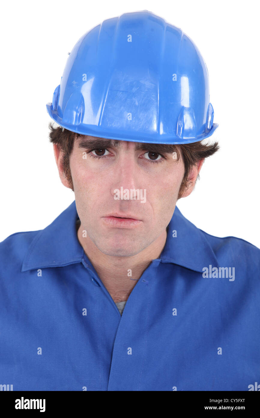 Portrait of a frowning construction worker Stock Photo