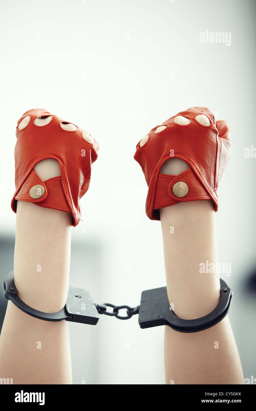 Two human hands in handcuffs. Vertical photo Stock Photo