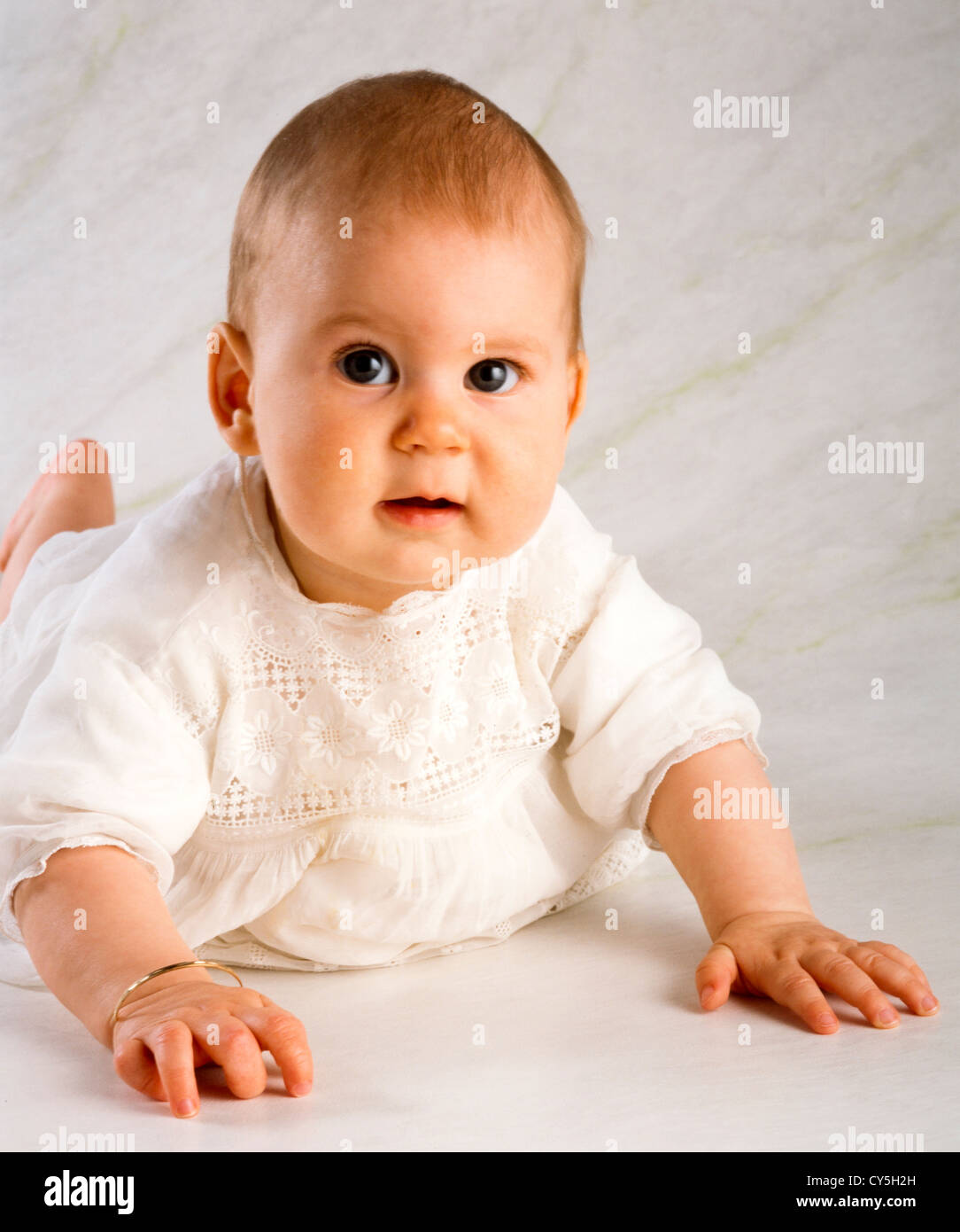 SIX MONTH OLD BABY GIRL,CRAWLING Stock Photo