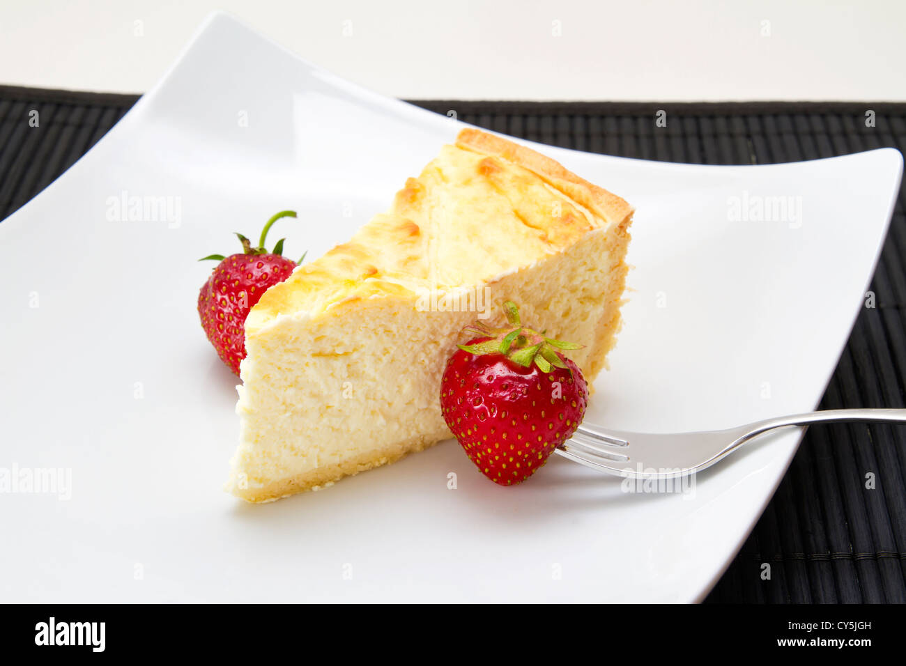 Cheesecake with strawberries and coffee Stock Photo