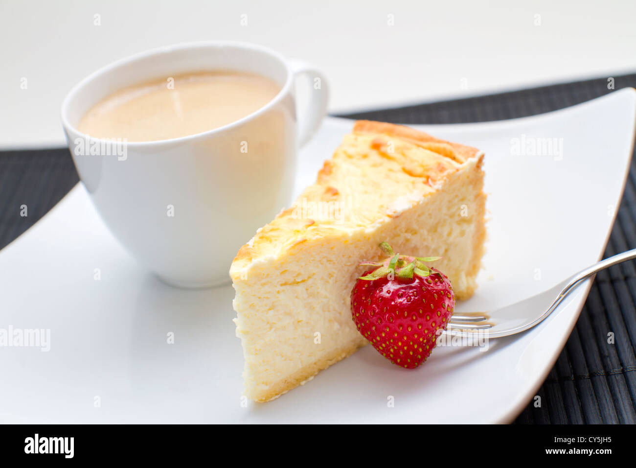 Cheesecake with strawberries and coffee Stock Photo