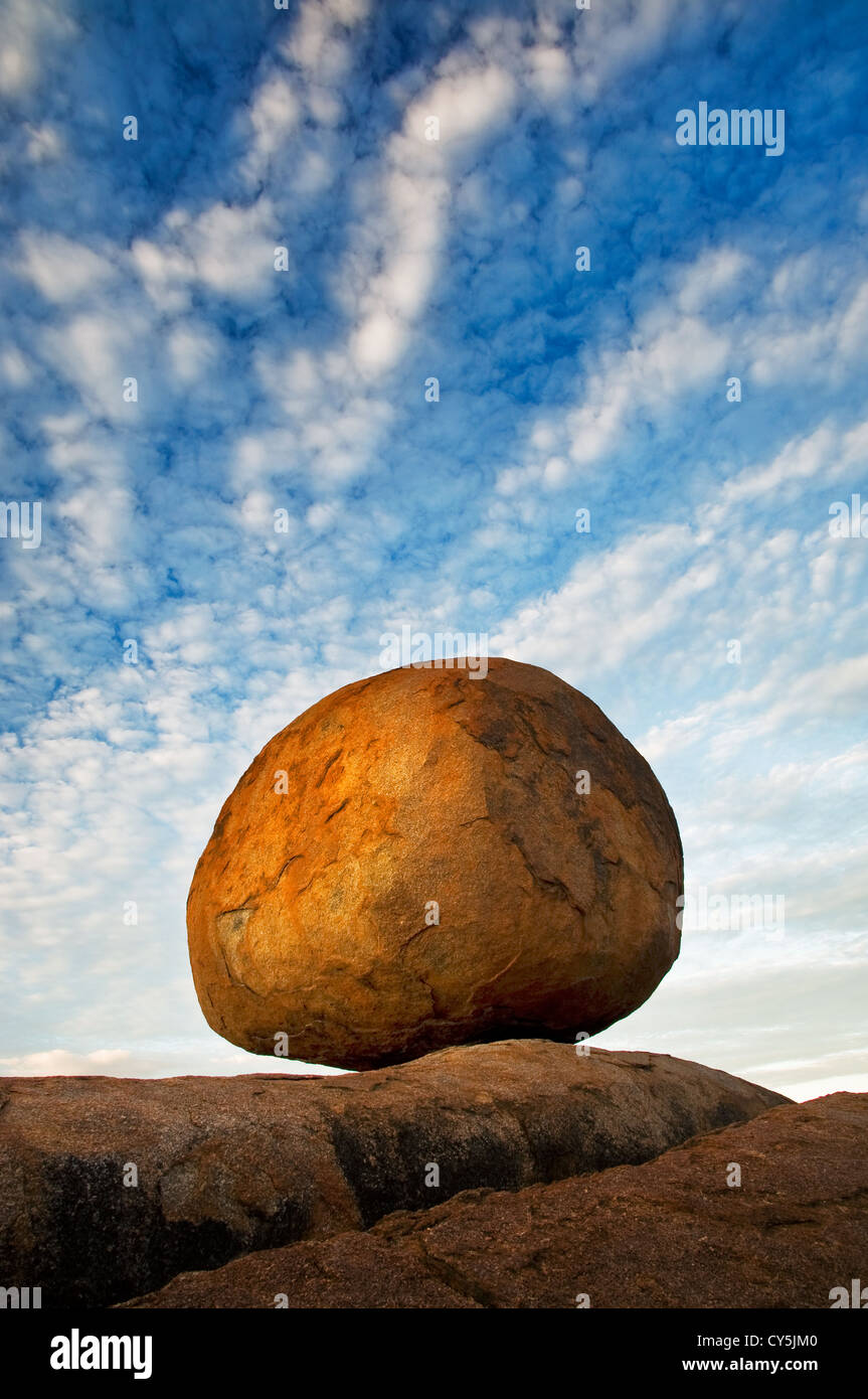 Balanced granite boulder of the Devils Marbles. Stock Photo