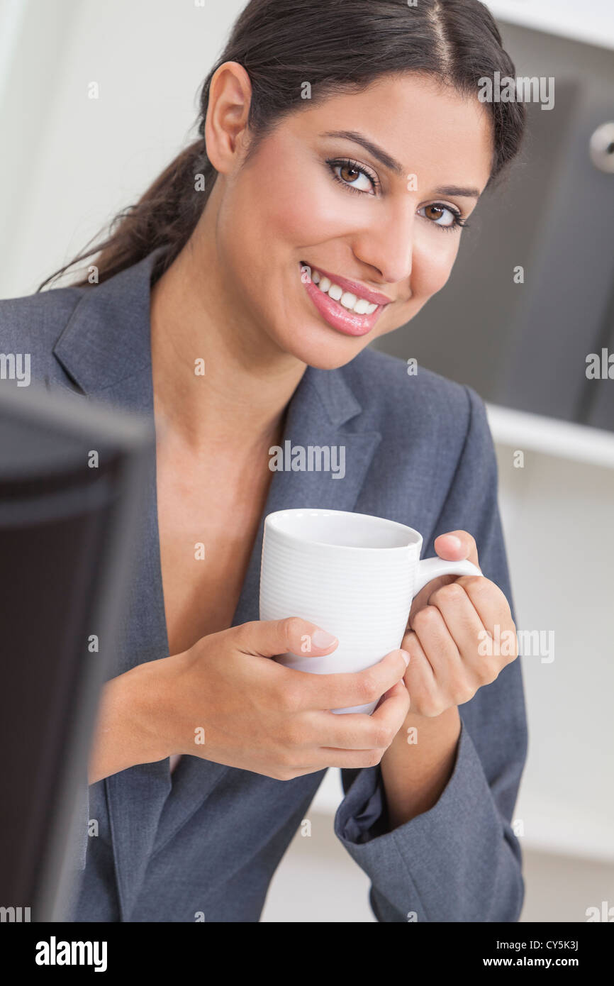 Beautiful young Latina Hispanic woman or businesswoman in smart ...