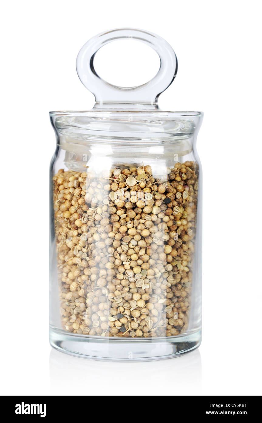 coriander in glass bottle isolated on white background Stock Photo Alamy