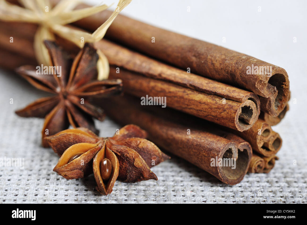 Cinnamon and anise closeup on beige tablecloth Stock Photo