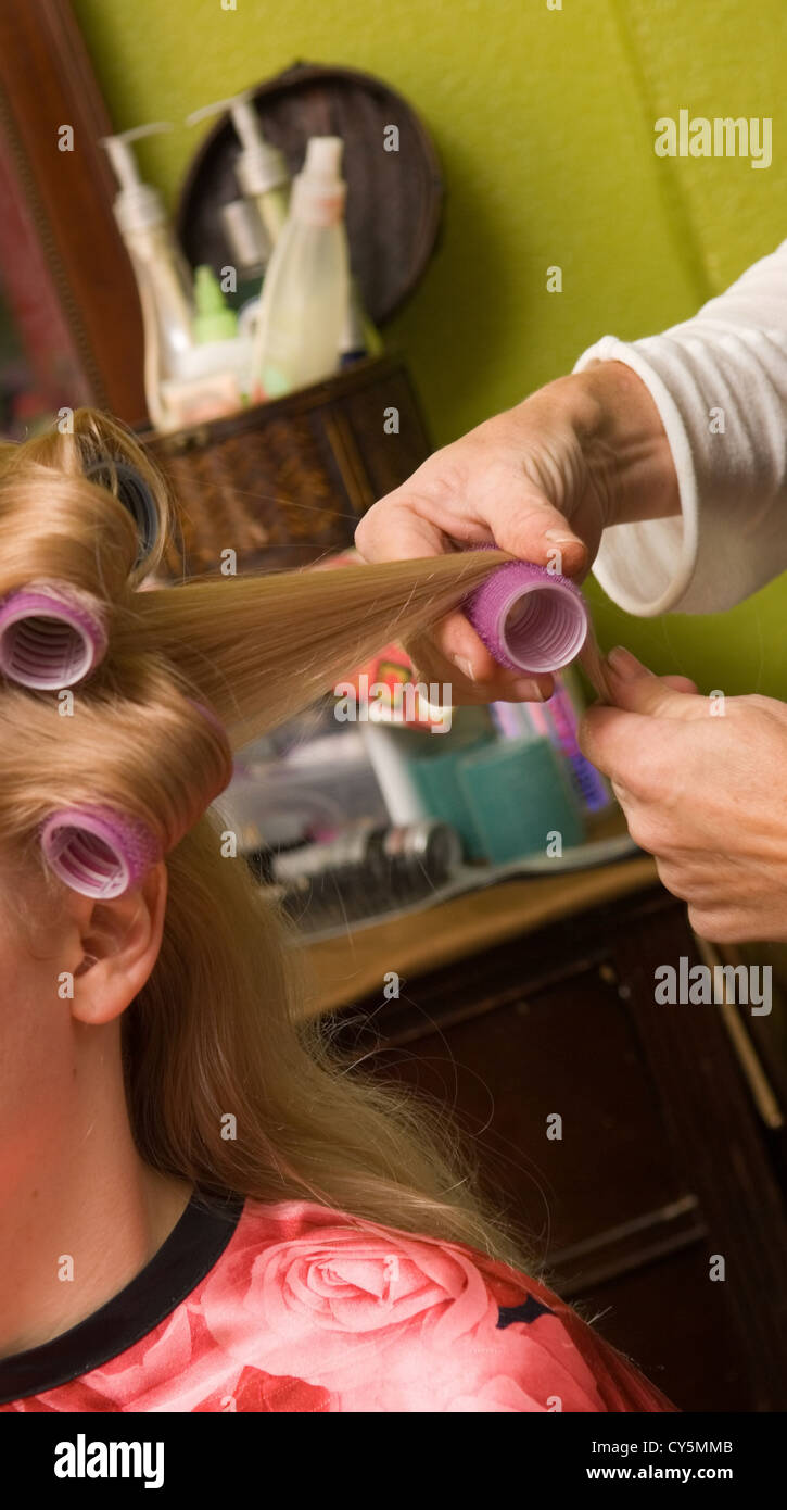 Girl getting Hair put large Velcro rollers Stock - Alamy