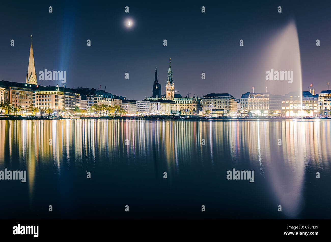 View across the Inner Alster Lake (Binnenalster) in Hamburg, Germany with the City Hall, the Nikolai and the Peter church Stock Photo