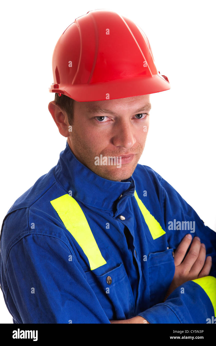 tradesman in work clothes wearing safety hat Stock Photo