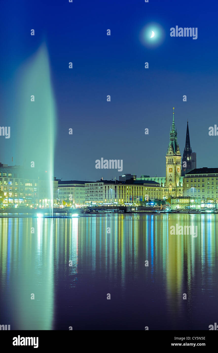 View across the Inner Alster Lake (Binnenalster) in Hamburg, Germany with the City Hall and the Nikolai church Stock Photo