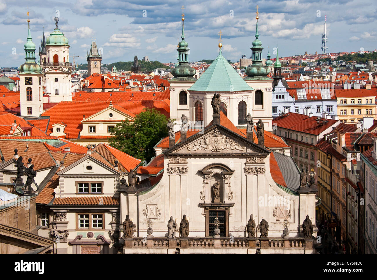 Church steeples of Old Town Prague with facade of St Salvator front center. Stock Photo