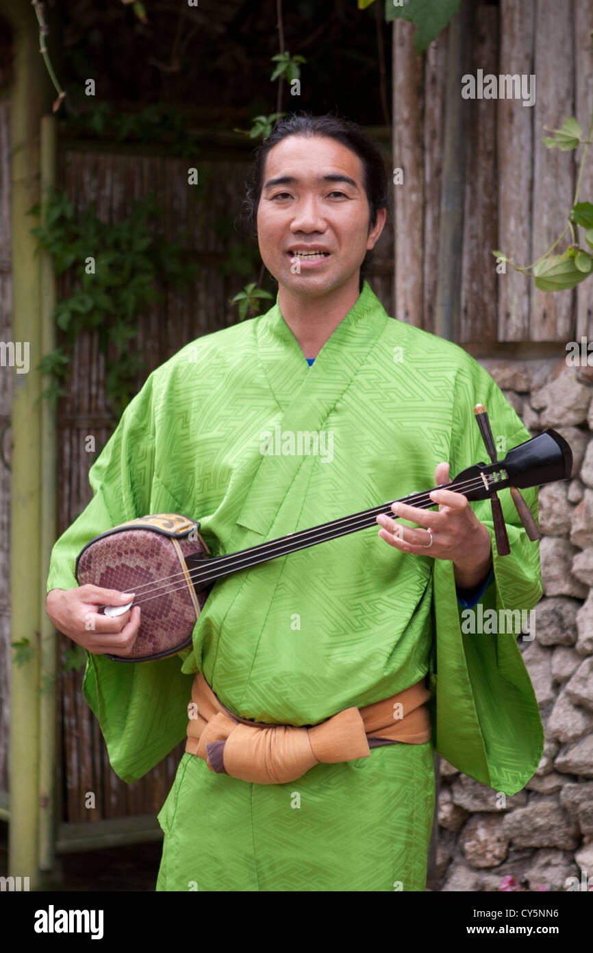 A Japanese man from Okinawa performs a traditional Sangen stringed