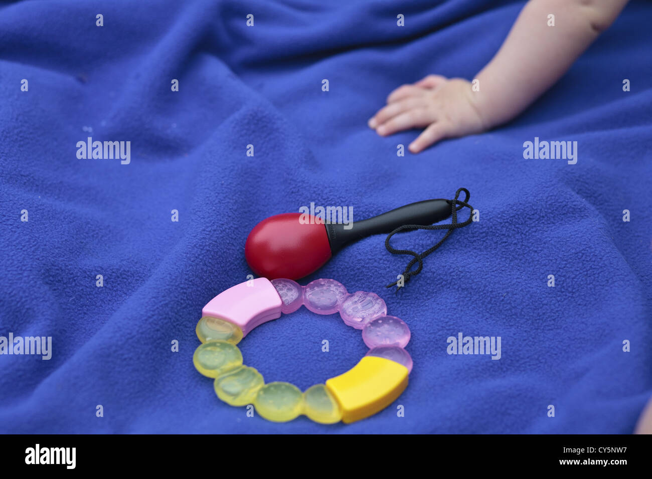 Baby's teething ring and rattle. Stock Photo