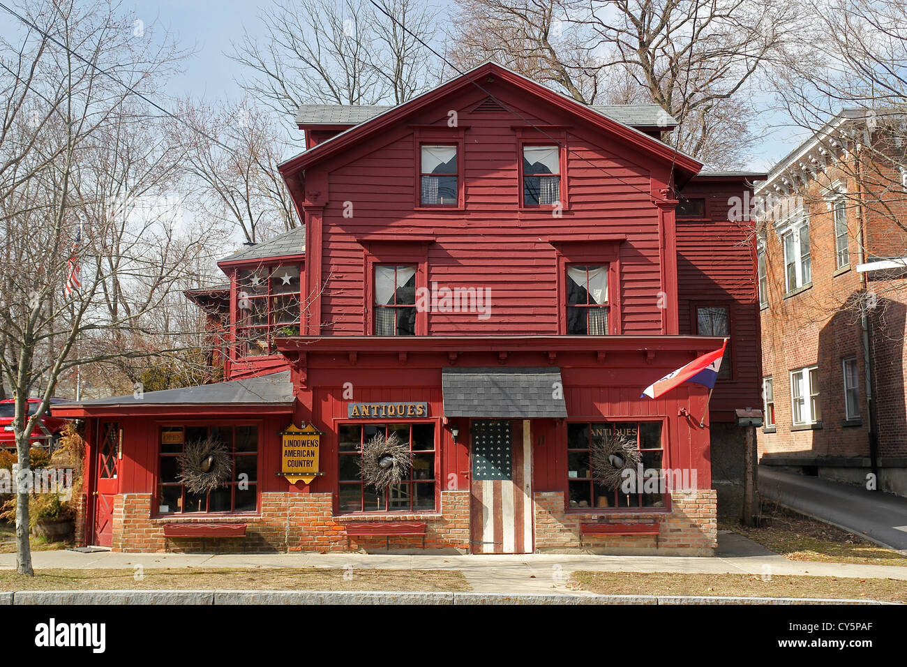 An antiques shop in an old red building in Kinderhook, New York Stock