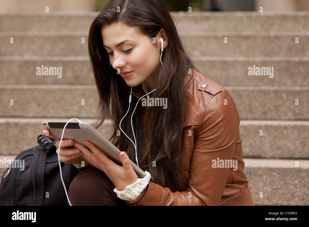 Beautiful young woman using Skype application on her ipad Stock Photo