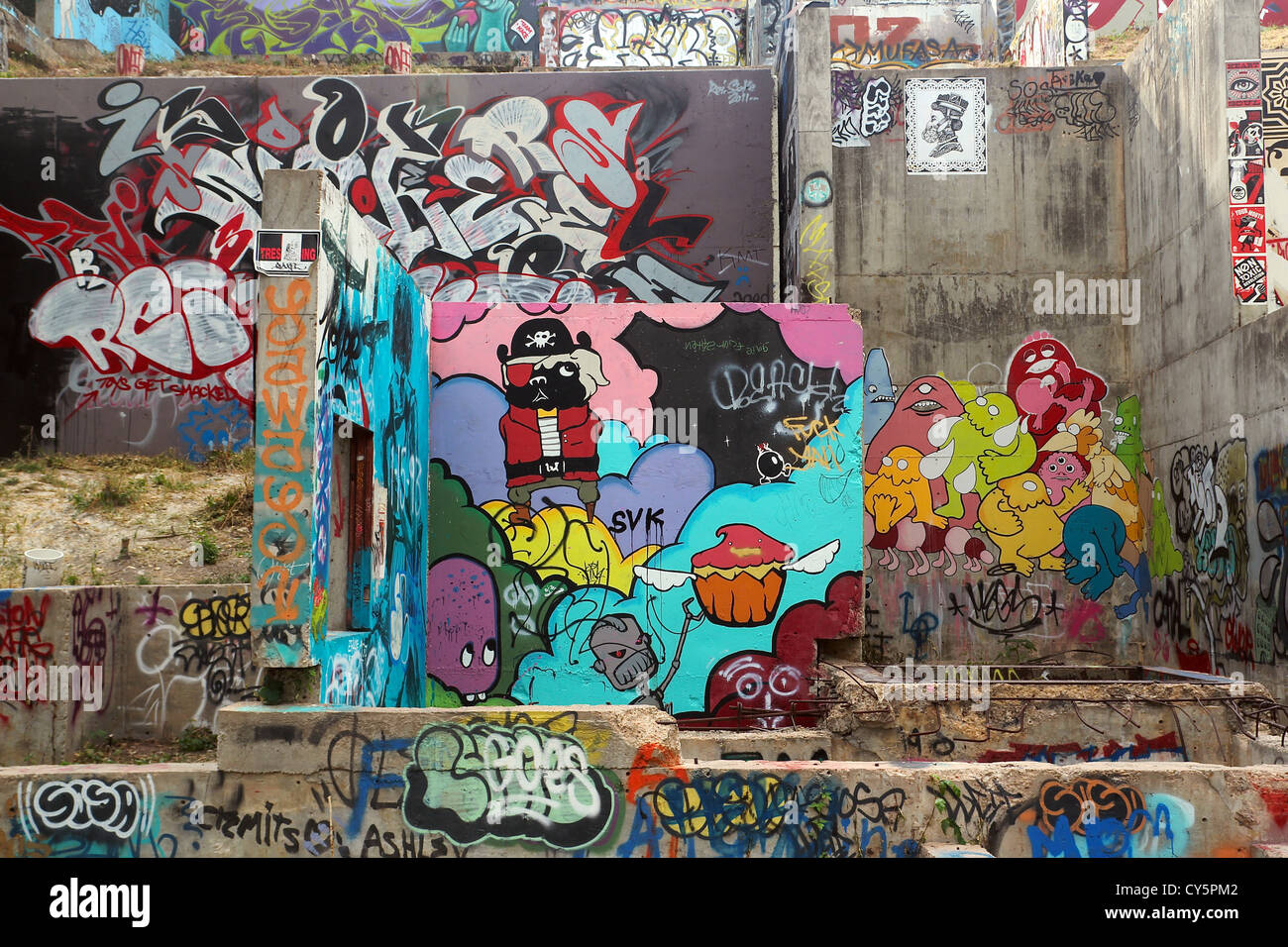Section of an abandoned concrete foundation in Austin which has been transformed into a city-sanctioned canvas for graffiti art Stock Photo
