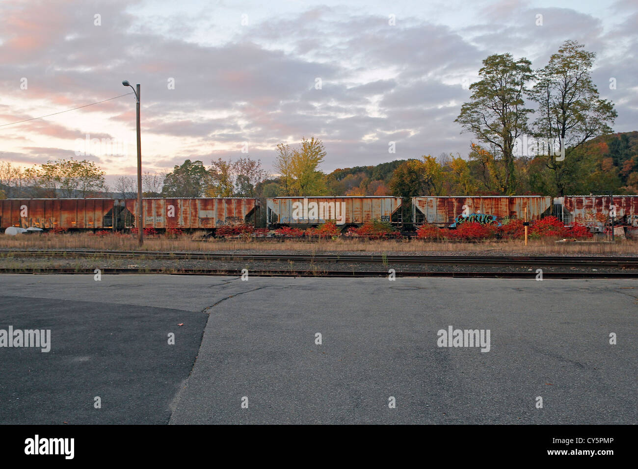 Old rail cars at Green Mountain Railroad in Bellows Falls, Vermont, at sunset Stock Photo